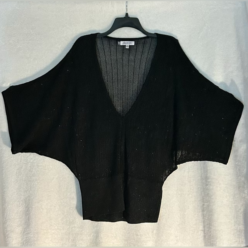 Jennifer Lopez black silver shimmery , bat winged sweater